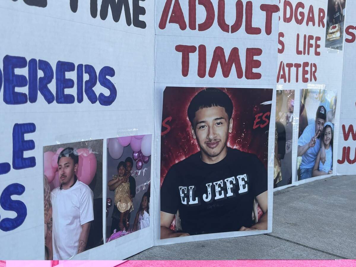 Demonstrators hold posters as they gather outside the Fresno County Juvenile Justice Center on Friday, Sept. 4, 2026, to push for a stiffer sentence for a 13-year-old who was sentenced to a year in the involuntary manslaughter case in which 19-year-old Edgar Hernandez was killed.
